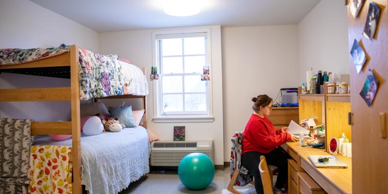 Student studies in her room on campus at Bryn Athyn College