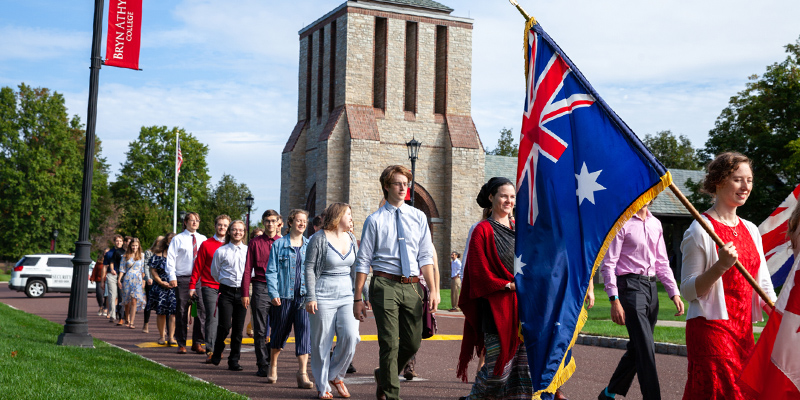 Students walk BAC campus during the Charter Day procession