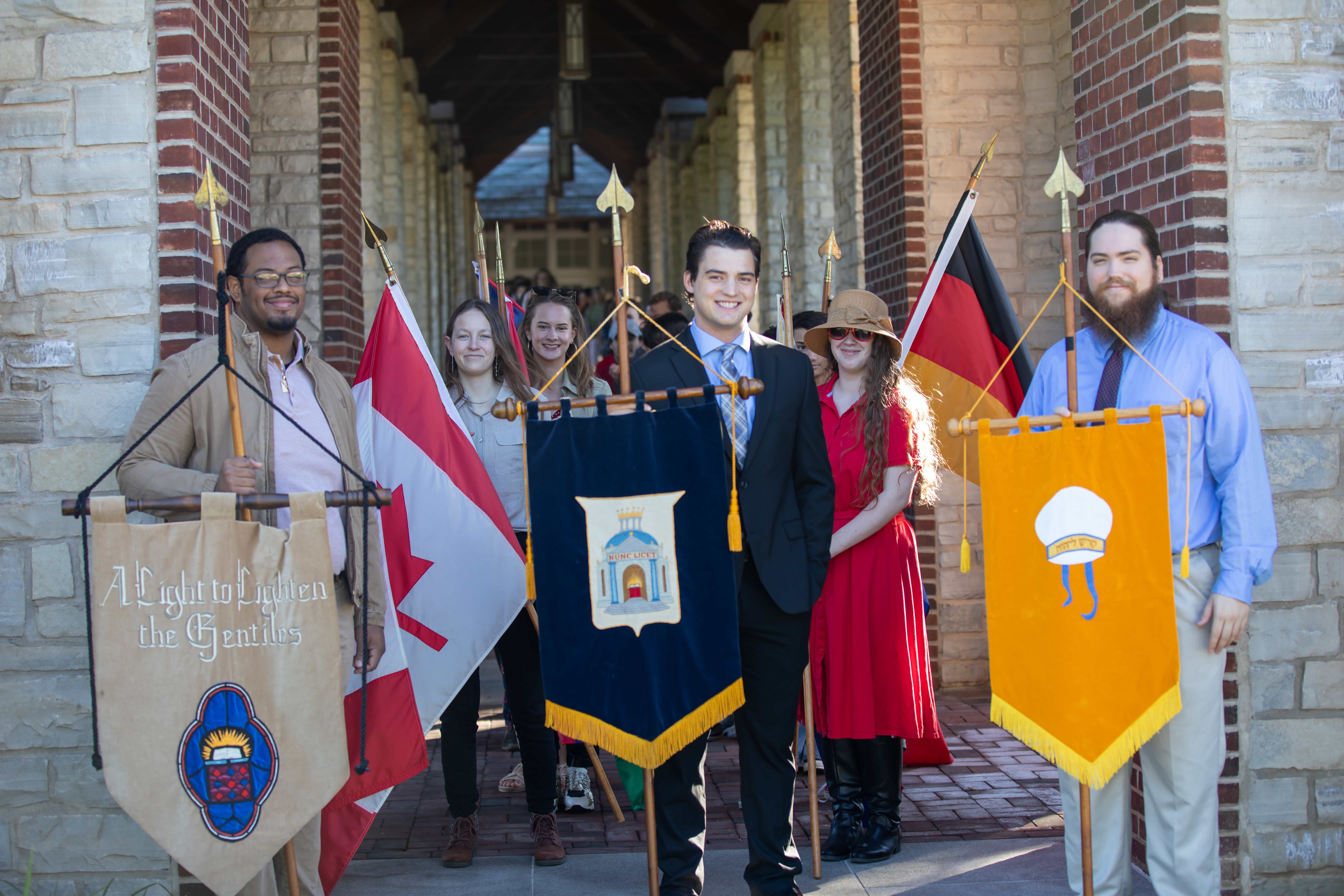 Students walk BAC campus during the Charter Day procession