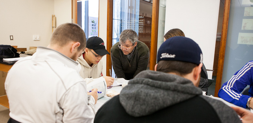 Bryn Athyn College science professor with his students in the Doering Center