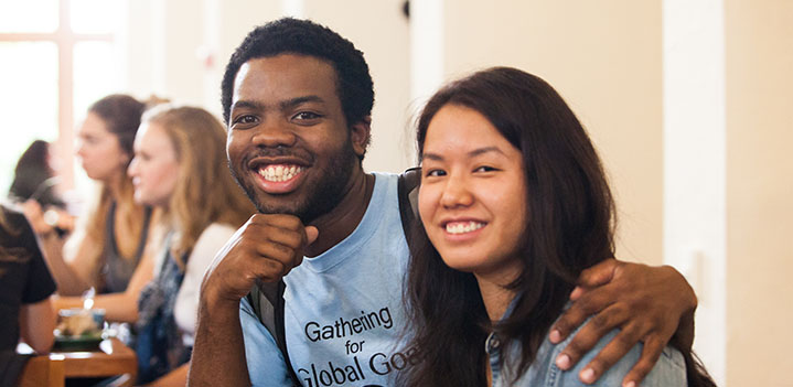 Students smile while at lunch in the Dining Hall