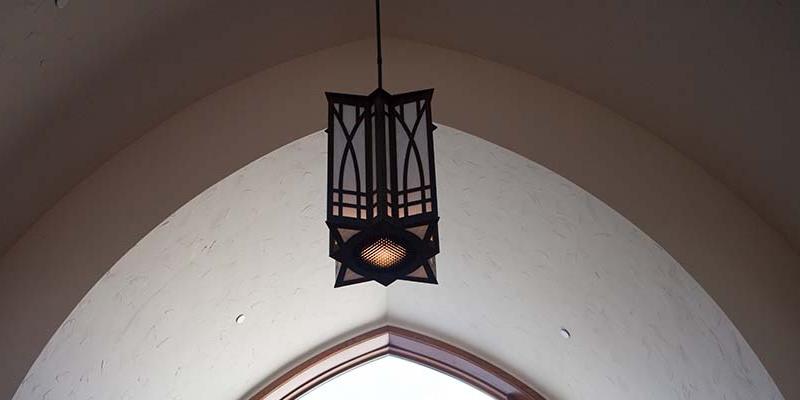 Bryn Athyn College lantern hanging from arched ceiling