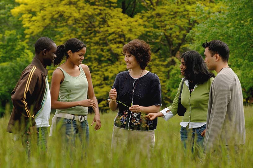 Bryn Athyn College professor and students in a field