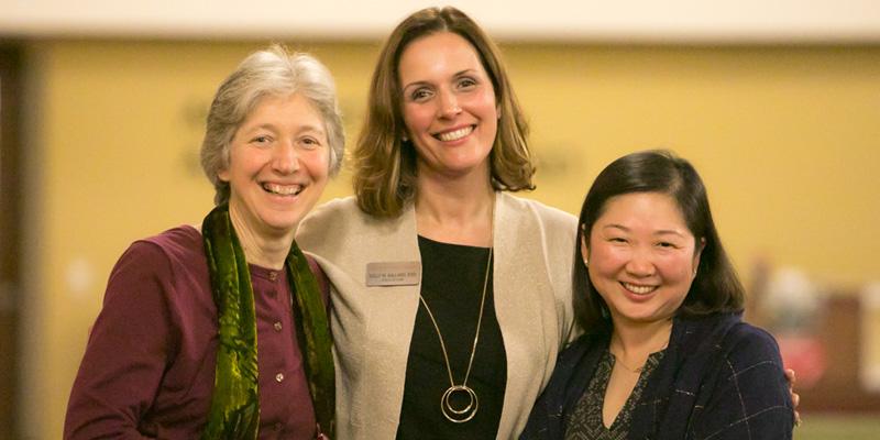 Dr. Ballard standing in the middle of her colleagues.