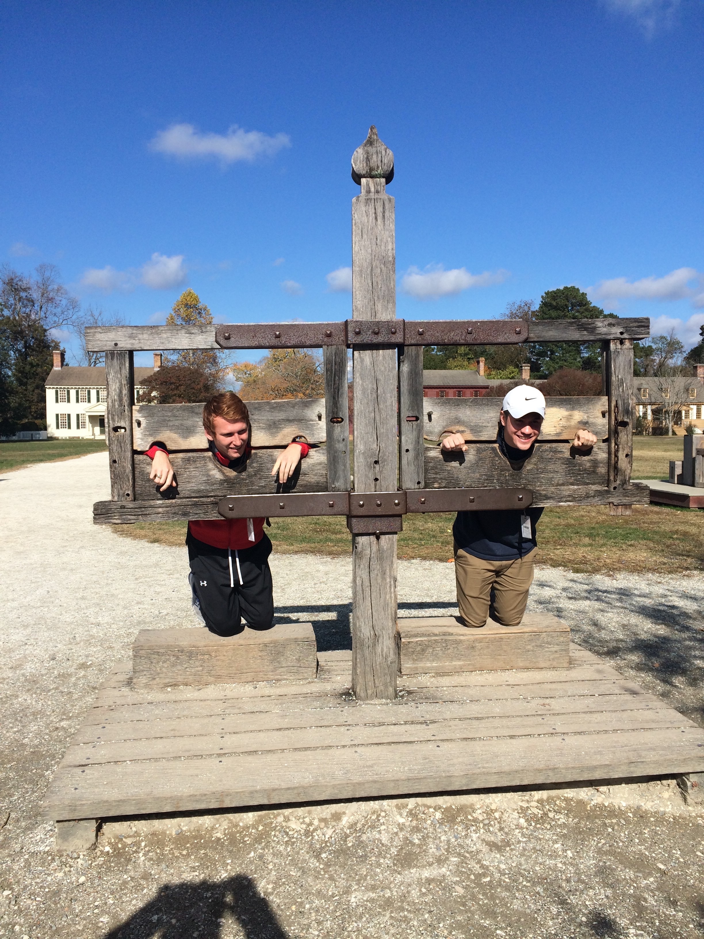 Bryn Athyn College students Brennen McCurdy (left) and Alex Hyatt (right) take a turn in the pillory