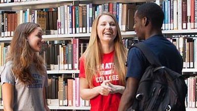 Bryn Athyn College students talking quietly on the second floor of the library